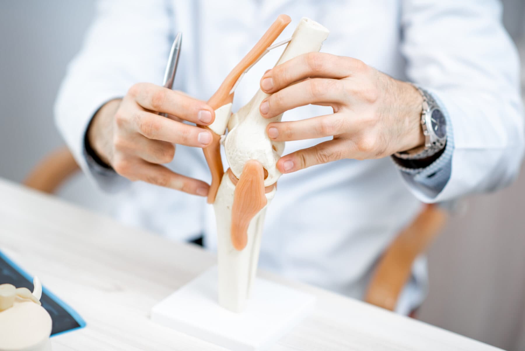 Surgeon holding knee